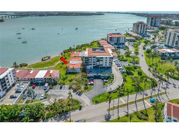 Enjoy an aerial view of the complex, landscaping, and waterfront views at 6357 Bahia Del Mar Blvd # 206, St Petersburg, FL 33715