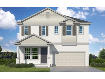 Charming two-story home with a two-car garage, neutral paint, and neat landscaping at 3000 N Highland Ave, Tampa, FL 33603