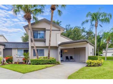 Charming townhome with well-maintained lawn and landscaping, neutral toned stucco and room for parking at 2646 Barksdale Ct, Clearwater, FL 33761