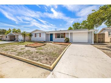 Charming single-story home with a well-maintained front yard and freshly painted exterior at 5346 Riddle Rd, Holiday, FL 34690