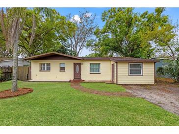 Charming single-story home with a well-maintained lawn and brick pathway leading to the front door at 3684 14Th Se Ave, Largo, FL 33771