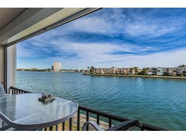 Enjoy expansive water views from the private balcony, perfect for relaxing or entertaining at 7645 Sun Island S Dr # 201, South Pasadena, FL 33707