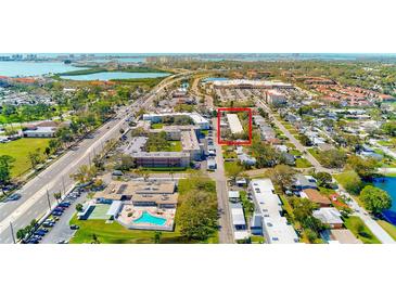 An aerial view showcases the property's location in a vibrant community near shopping, dining, and natural attractions at 9945 47Th N Ave # 101, St Petersburg, FL 33708