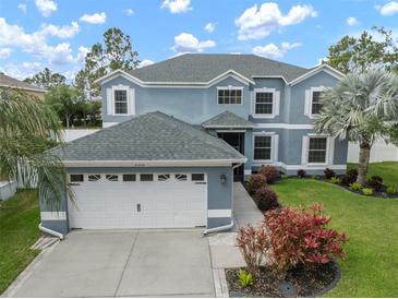 Beautiful two-story home with a large garage, fresh paint, and well-manicured lawn at 11310 Callaway Pond Dr, Riverview, FL 33579
