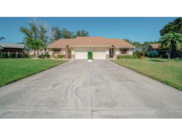 Charming single-story home with a well-manicured lawn and spacious driveway, perfect for comfortable living at 440 Pendleton Dr, Venice, FL 34292