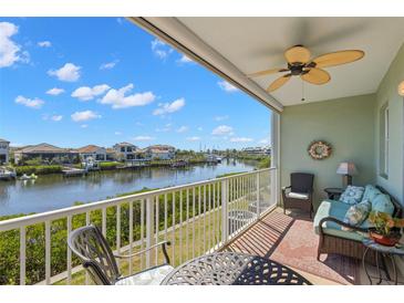 Relax on the balcony with a ceiling fan and beautiful water views in this gorgeous listing at 545 Bahia Beach Blvd, Ruskin, FL 33570