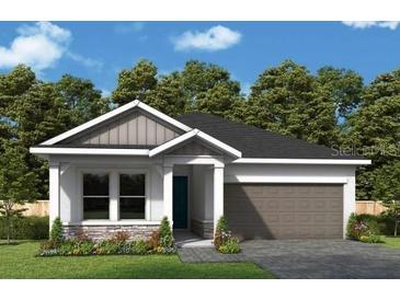 Charming single-Gathering home with a well-manicured lawn, inviting entrance, and attached garage at 10640 Crescent Creek Xing, Parrish, FL 34219