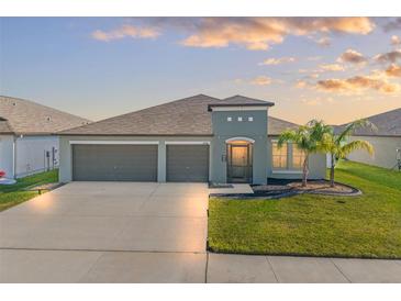 Beautiful single-Gathering home with a well-kept lawn and a spacious three-car garage at 13538 Willow Bluestar Loop, Riverview, FL 33579