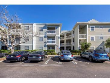 Attractive condominium building with reserved covered parking and balconies for residents and guests at 6826 Stones Throw N Cir # 11104, St Petersburg, FL 33710