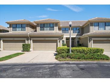 Charming multi-Gathering home featuring well-maintained landscaping, garages, and a warm, inviting facade at 13208 San Blas Loop, Largo, FL 33774