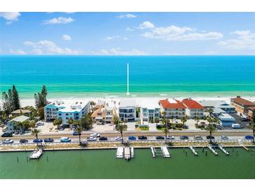 Stunning waterfront home with private dock, sandy beach, and panoramic views of the Gulf of Mexico at 32 Gulf Blvd, Indian Rocks Beach, FL 33785