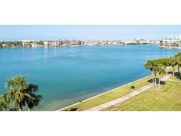 Expansive water view showcasing the waterfront property and beautiful blue water on a bright day at 8020 Sailboat Key S Blvd # 404, St Pete Beach, FL 33707