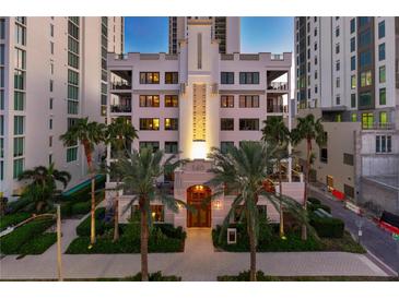 Stunning building exterior with palm trees and manicured landscaping in a vibrant urban setting at twilight at 146 4Th Ne Ave # 600, St Petersburg, FL 33701