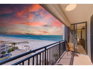 Enjoy breathtaking ocean views from this private balcony with black railing, creating a serene coastal retreat at 3820 Gulf Blvd # 802, St Pete Beach, FL 33706