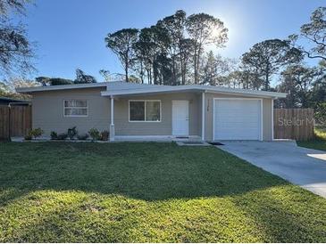 Charming single-story home with a well-maintained lawn and inviting curb appeal at 7126 Oelsner St, New Port Richey, FL 34652