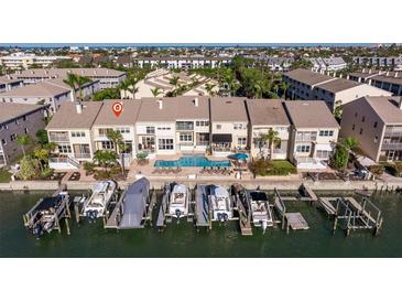 Stunning waterfront home featuring a private pool and boat dock with multiple boat slips for easy ocean access at 487 Pinellas Bayway S # 6, Tierra Verde, FL 33715