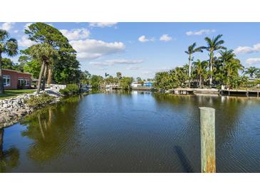 Scenic waterfront view featuring a serene body of water surrounded by lush tropical vegetation at 1516 Massachusetts Ne Ave, St Petersburg, FL 33703