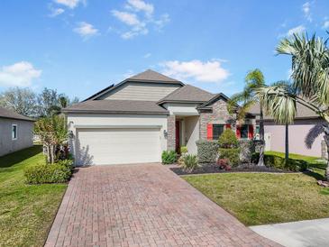 Charming single-Gathering home boasting well-manicured landscaping and a brick driveway at 7515 37Th E Ave, Palmetto, FL 34221