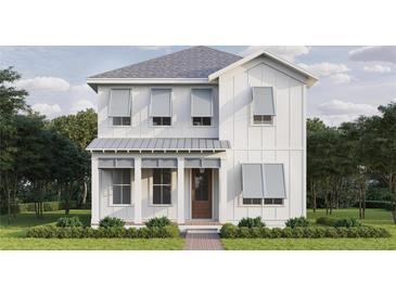 Charming two-story home boasts a white exterior, stylish gray shutters, and a well-manicured front lawn at 116 19Th Se Ave, St Petersburg, FL 33705