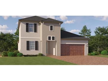 Charming two-story home with a well-manicured lawn and a spacious two-car garage at 31794 Griffin Sands Ln, San Antonio, FL 33576