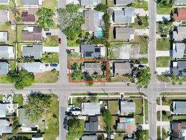 Aerial view of the home outlined in red, with surrounding homes and neighborhood streets at 1800 New Hampshire Ne Ave, St Petersburg, FL 33703