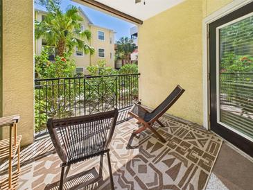 Cozy balcony with outdoor seating and garden view, perfect for relaxing and enjoying the fresh air at 1810 E Palm Ave # 6104, Tampa, FL 33605