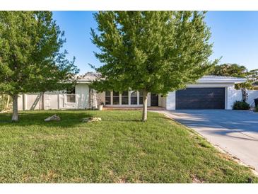 Charming single-story home featuring a well-manicured lawn and mature trees providing ample shade at 4127 53Rd S Ave, St Petersburg, FL 33711