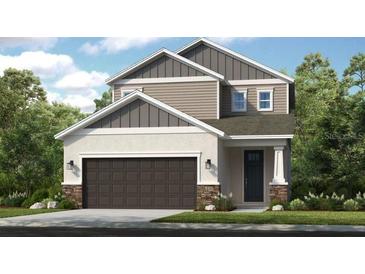 New two-story home featuring a two-car garage, neutral color palette, and professionally landscaped yard at 740 Steel Dr, Apollo Beach, FL 33572
