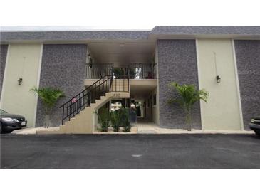 The exterior showcases stone accents, complemented by well-maintained landscaping and convenient parking spaces at 430 Larboard Way # 3, Clearwater Beach, FL 33767