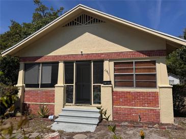 Charming bungalow-style home with red brick accents and inviting front porch at 1067 15Th S Ave, St Petersburg, FL 33705