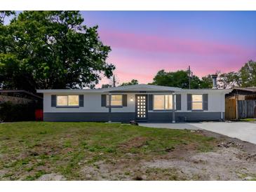 Charming single-story home featuring a freshly painted exterior and a well-manicured front yard at 10686 110Th Ln, Largo, FL 33778