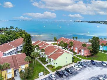 Aerial view of condo complex, showing proximity to the bay and complex parking at 3735 42Nd S Way # J, St Petersburg, FL 33711