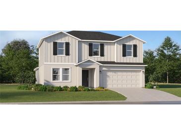 Charming two-story home featuring a two-car garage, well-maintained landscaping and a welcoming front entrance at 11888 Brae Way, Dade City, FL 33525