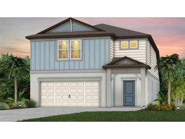 Charming two-story home with light blue siding, a two-car garage, and well-manicured landscaping at 9767 Crescent Moon Dr, Riverview, FL 33578