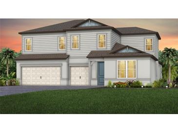 Charming two-story home featuring a two-car garage and lush landscaping at 1672 Valier Pt, Zephyrhills, FL 33541