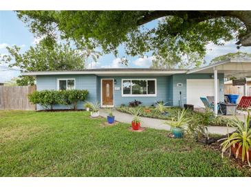 Charming single-story home with well-maintained lawn and landscaped garden beds at 1901 66Th N Ave, St Petersburg, FL 33702
