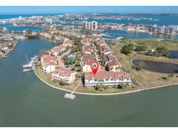 Beautiful aerial view of a waterfront condo with a private dock and access to the bay at 553 Haven Point Dr, Treasure Island, FL 33706