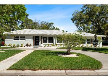 Charming single-story home featuring a landscaped front yard and a freshly painted exterior at 6531 2Nd N Ave, St Petersburg, FL 33710