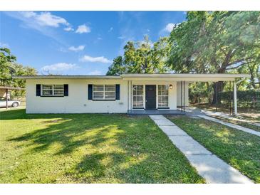 Charming single-story home featuring a well-maintained lawn and inviting covered front porch at 513 E Langford Dr, Plant City, FL 33563