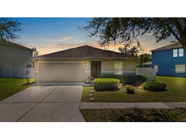 Charming single-story home with a well-maintained lawn, two-car garage, and welcoming curb appeal at 15616 Greyrock Dr, Spring Hill, FL 34610