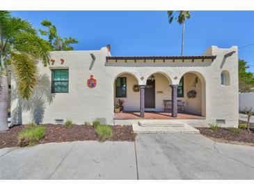 Charming stucco home featuring an arched porch and decorative details for a unique curb appeal at 4509 10Th N Ave, St Petersburg, FL 33713