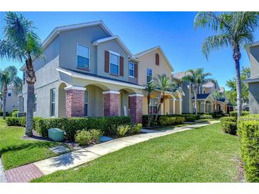 Charming multi-Gathering residential buildings with brick columns and well-maintained landscaping under a clear sky at 12646 Carlby Cir, Tampa, FL 33626