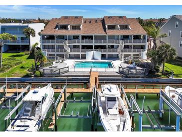 Waterfront condo with boat slips and a sparkling pool in a picturesque coastal setting at 350 Pinellas Bayway S # 2, St Petersburg, FL 33715