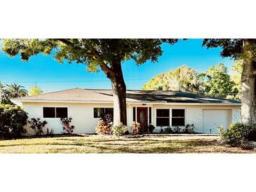 Charming single-story home with a manicured lawn and mature tree offering curb appeal at 2114 Indian N Ave, Belleair Bluffs, FL 33770
