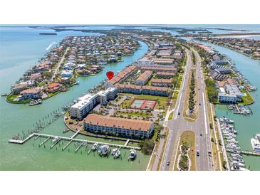 Beautiful waterfront condo community with boat docks, tennis courts, and easy highway access at 301 Madeira Cir, Tierra Verde, FL 33715