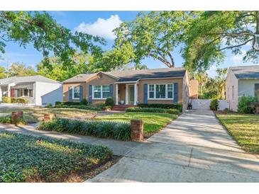 Charming single-story home features a manicured lawn and a long driveway at 2931 W Coachman Ave, Tampa, FL 33611