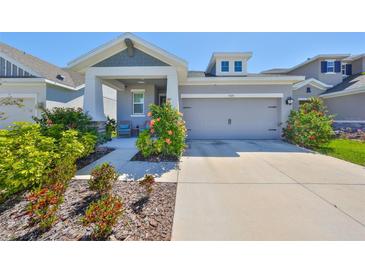 Charming single-story home with well-maintained landscaping, inviting curb appeal, and attached garage at 5523 Del Coronado Dr, Apollo Beach, FL 33572