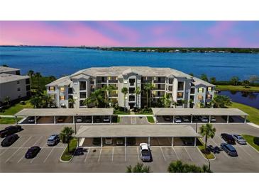 Beautiful condo building with covered parking and waterfront views at 1030 Tidewater Shores Loop # 104, Bradenton, FL 34208
