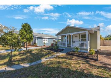 Charming single-story home featuring a cozy front porch and well-manicured landscaping at 1160 36Th N Ave, St Petersburg, FL 33704