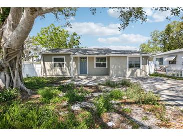 Charming home featuring a neutral color scheme, well-maintained landscaping, and inviting curb appeal at 1000 8Th Sw Ave, Largo, FL 33770